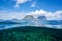 Mt. Lidgebird (left) & Mt. Gower (right) towering above the Lord Howe Island lagoon. Above & below the surface, the island supports an immense biodiversity of life. You can truly feel how the health of both land, sea, & the human community are inextricably linked to health of the island as one whole, connected living system.